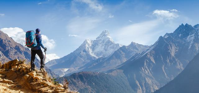 Happy hiker winning reaching life goal, success, freedom and happiness